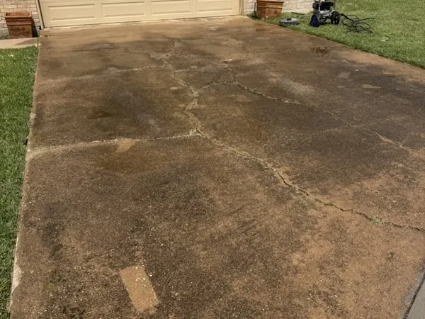 Real Plano driveway. Drag to compare., before cleaning